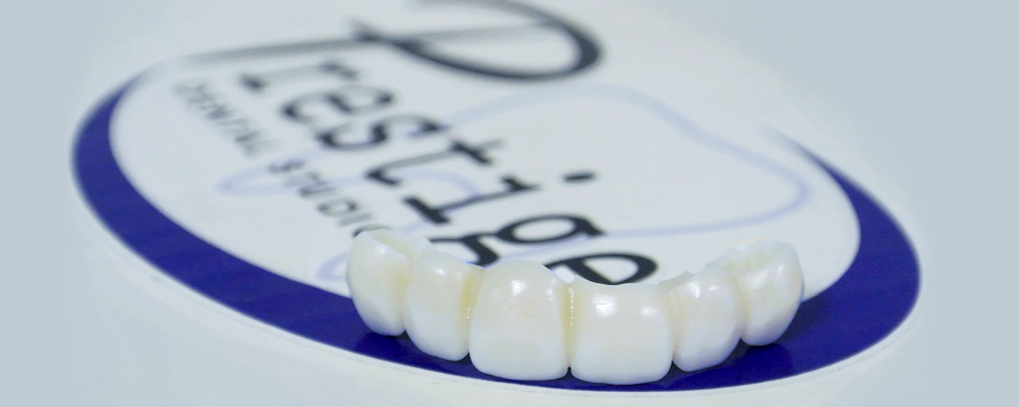 Teeth on Prestige Logo